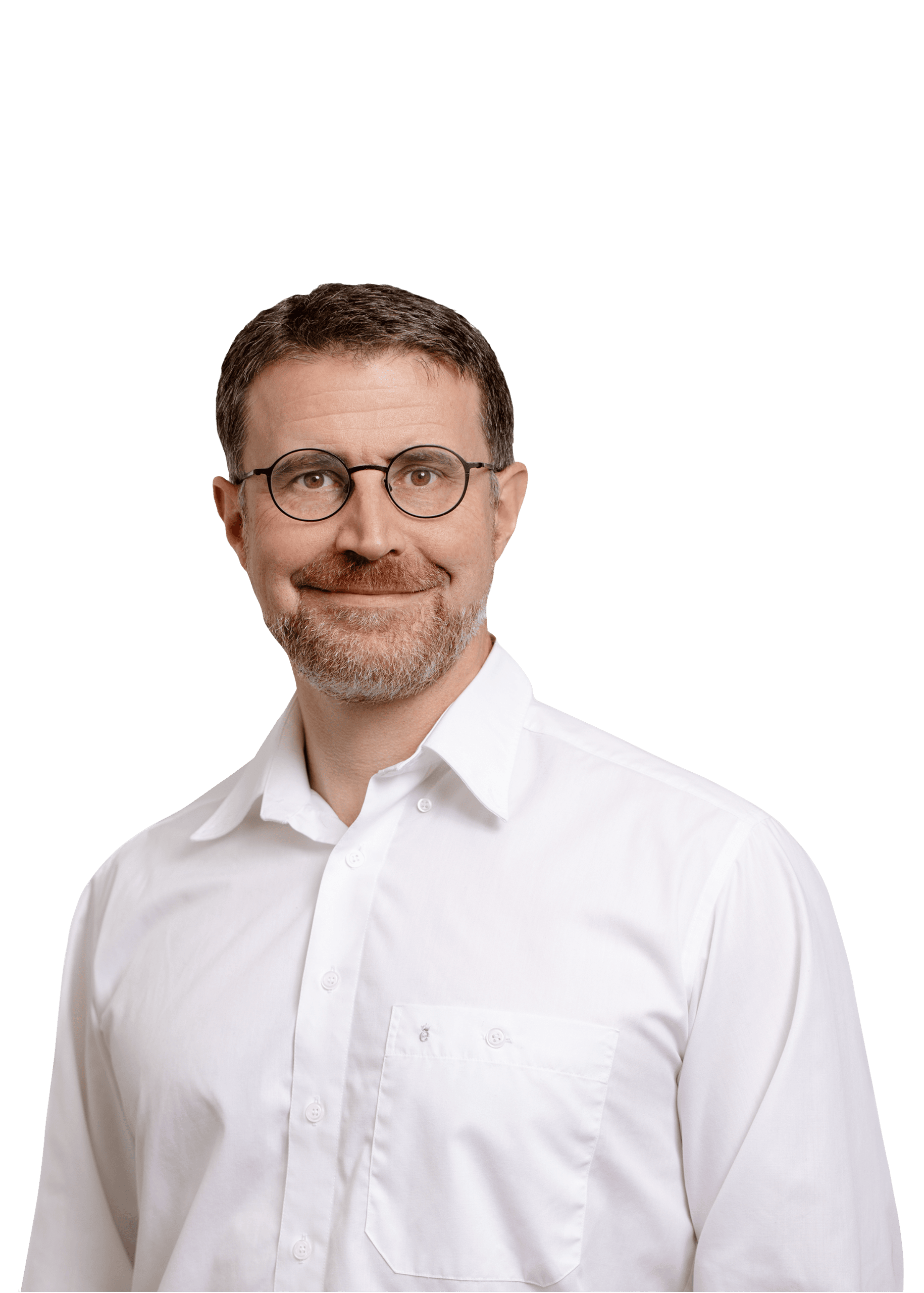 frauenaerzte-loerrach-schopfheim-dib Mann lächelt in die Kamera. Dunkle Haare, weißes Oberteil. Freundlicher Gesichtsausdruck.